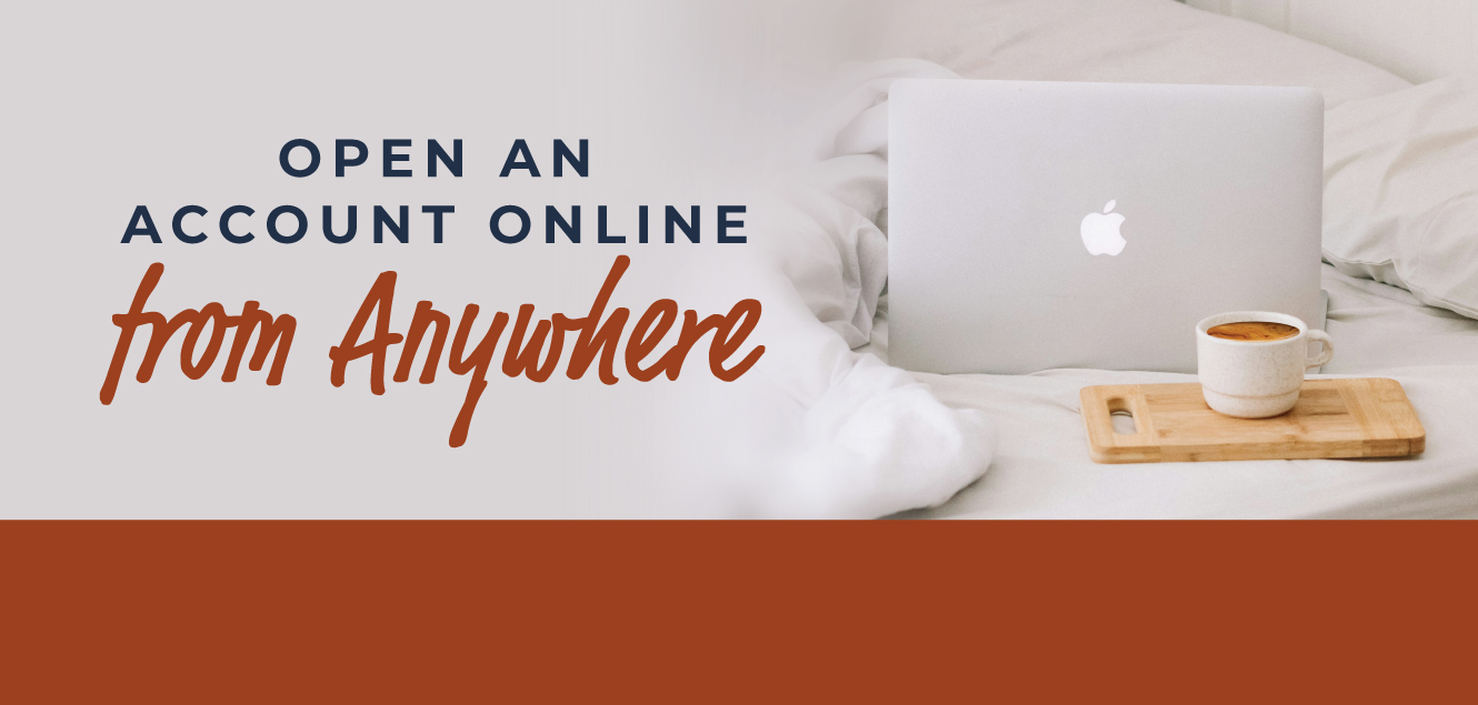 laptop on bed with cup of coffee - open an account online from anywhere